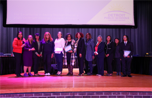  DPSCD Board members standing on stage with April Board Recognition recipients
